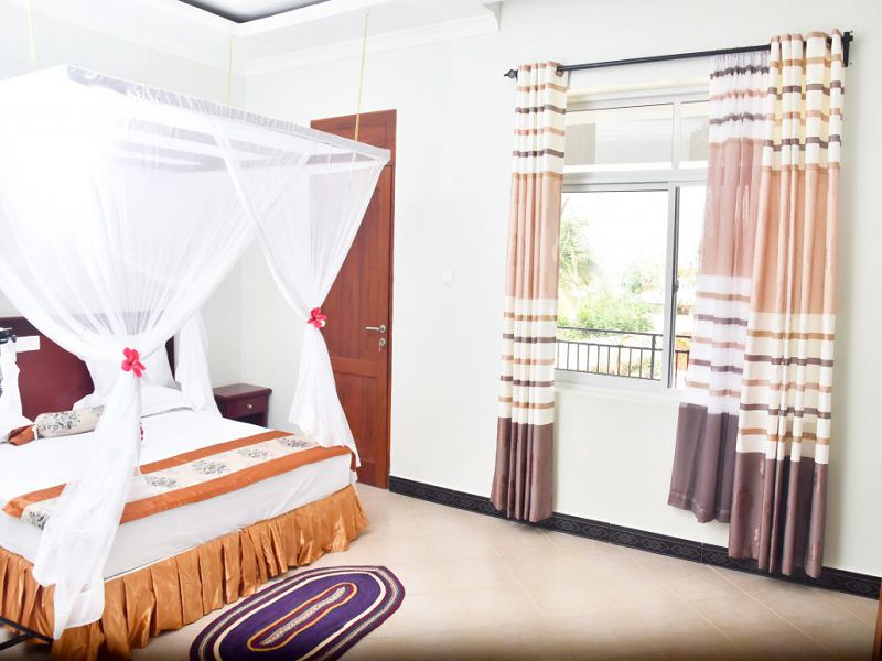 Junior-suite-Room-with-private-balcony_village-view-1-1030x687